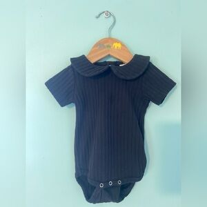 Kate Quinn black ribbed onsie with Peter Pan collar